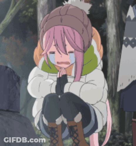 A Girl With Pink Hair Is Kneeling Down And Crying With Her Eyes Closed GIF