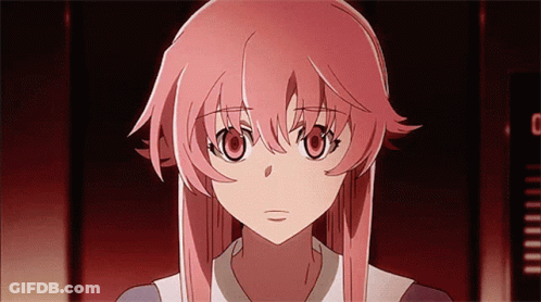 A Girl With Pink Hair Is Looking At The Camera With A Clock In The Background GIF