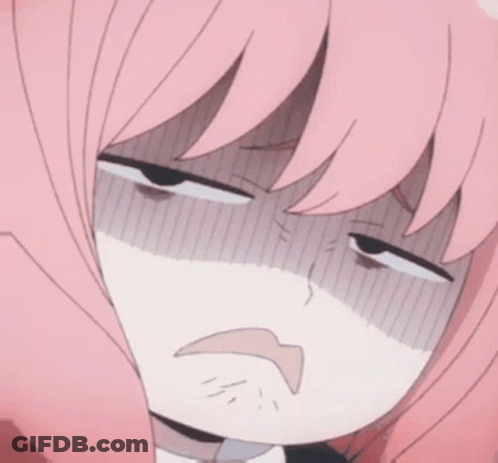 A Girl With Pink Hair Is Making A Funny Face . GIF