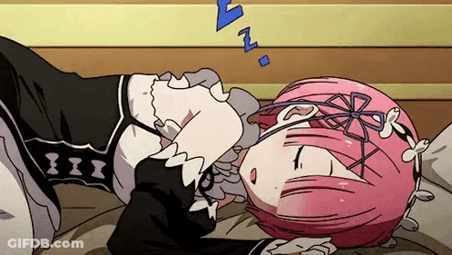 A Girl With Pink Hair Is Sleeping On A Bed With Her Head On A Pillow . GIF