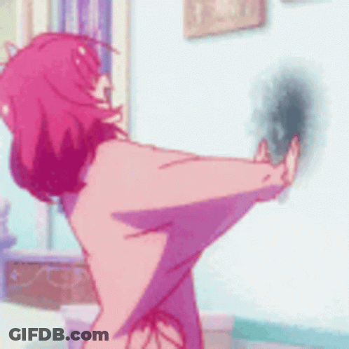 A Girl With Pink Hair Is Standing In A Room GIF