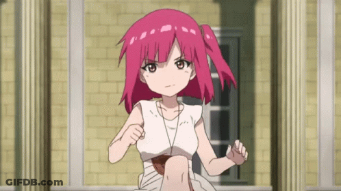 A Girl With Pink Hair Is Standing In Front Of A Brick Wall GIF
