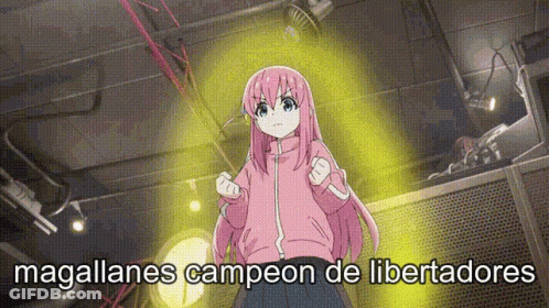 A Girl With Pink Hair Is Standing In Front Of A Yellow Light And The Words Magallanes Campeon De Libertadores Are Writte GIF