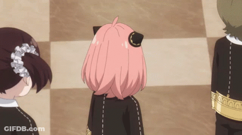 A Girl With Pink Hair Is Wearing A Black Outfit GIF