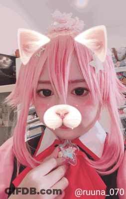 A Girl With Pink Hair Is Wearing A Cat Costume And Has The Number 070 On Her Face GIF
