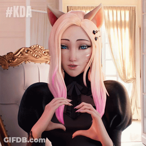 A Girl With Pink Hair Making A Heart Shape With Her Hands With #Kda Written Above Her GIF