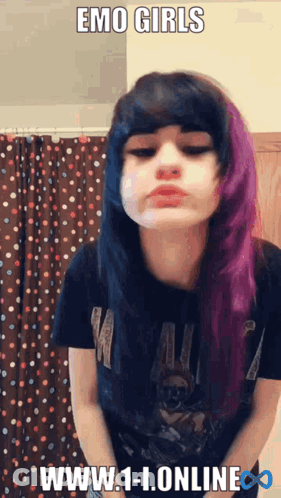 A Girl With Purple And Black Hair Is Wearing A Black Shirt GIF