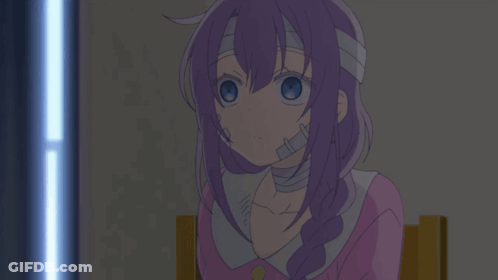 A Girl With Purple Hair And A Bandage On Her Head Sits In A Chair GIF
