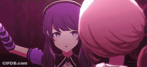 A Girl With Purple Hair And Blue Eyes Is Standing Next To Another Girl With Pink Hair . GIF
