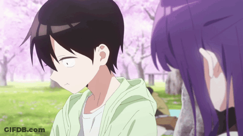 A Girl With Purple Hair Looks At A Boy In A Park GIF