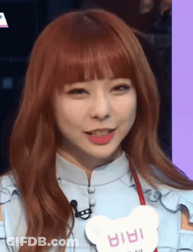 A Girl With Red Hair And A Name Tag That Says ' Iria ' GIF