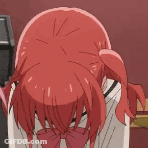 A Girl With Red Hair And A Red Bow Tie Is Bending Over And Praying . GIF