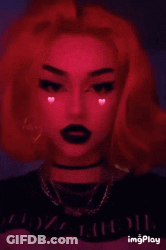 A Girl With Red Hair And Black Lipstick Is Wearing A Choker . GIF