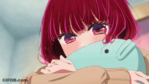 A Girl With Red Hair And Blue Eyes Is Covering Her Face With A Blanket GIF