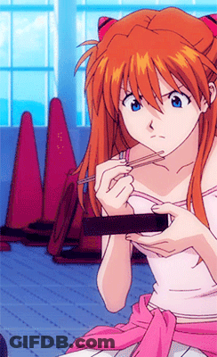 Girl With Red Hair And Blue Eyes Eating With Chopsticks GIF