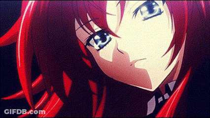 A Girl With Red Hair And Blue Eyes Is Looking At The Camera GIF