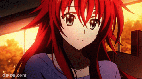 A Girl With Red Hair And Blue Eyes Is Smiling GIF