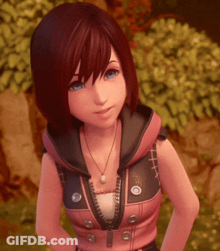 A Girl With Red Hair And Blue Eyes Is Wearing A Pink Jacket With A Hood And A Necklace . GIF