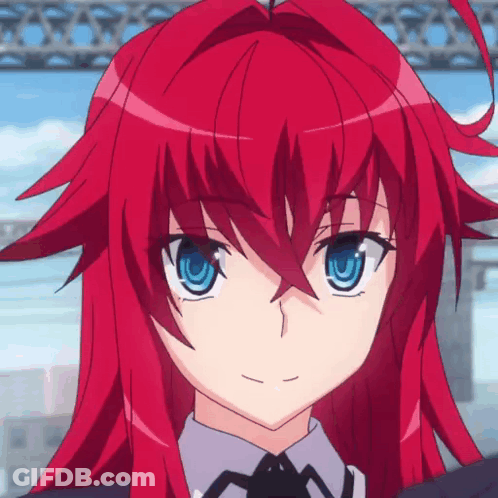 A Girl With Red Hair And Blue Eyes Is Wearing A Suit And Tie GIF