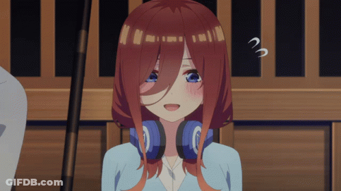 A Girl With Red Hair And Blue Eyes Is Wearing Headphones And Making A Surprised Face GIF