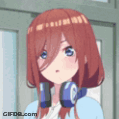 A Girl With Red Hair And Blue Eyes Wearing Headphones . GIF