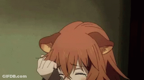 A Girl With Red Hair And Cat Ears Is Holding Her Hair . GIF