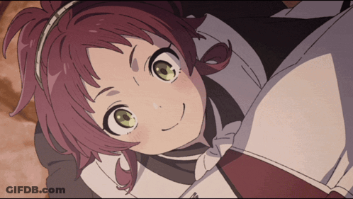 A Girl With Red Hair And Green Eyes Laying Down GIF