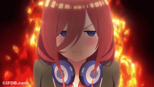 A Girl With Red Hair And Headphones Looks Angry GIF