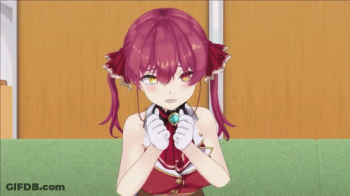 A Girl With Red Hair And White Gloves Is Sitting On A Green Carpet GIF