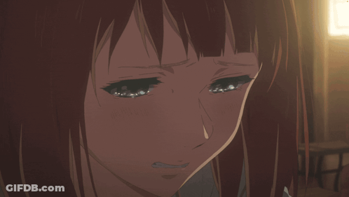 A Girl With Red Hair Is Crying With Her Eyes Closed GIF