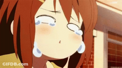 A Girl With Red Hair Is Crying With Her Eyes Closed And Tears Coming Out Of Her Eyes . GIF