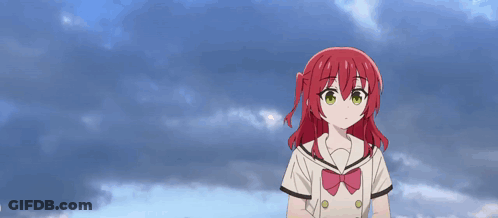 A Girl With Red Hair Is Holding A Cucumber And A Sushi Roll GIF