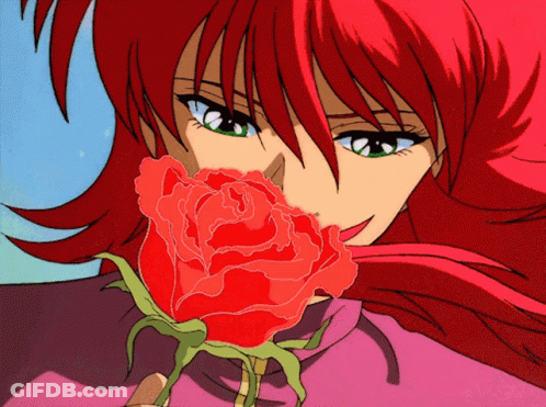 A Girl With Red Hair Is Holding A Red Rose In Her Hand GIF