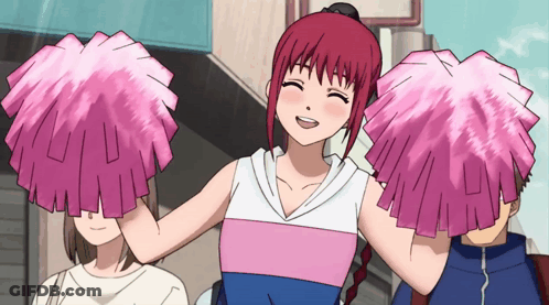 A Girl With Red Hair Is Holding Pink Pom Poms GIF