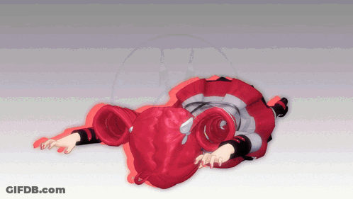 A Girl With Red Hair Is Laying On The Ground GIF