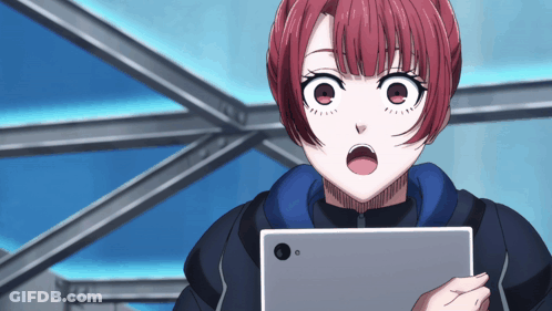 A Girl With Red Hair Is Looking At A Tablet GIF
