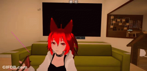 A Girl With Red Hair Is Sitting On A Green Couch In Front Of A Television GIF