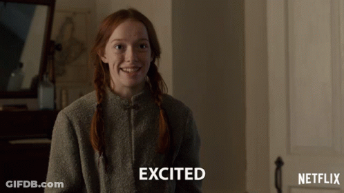 A Girl With Red Hair Is Smiling With The Word Excited Above Her GIF