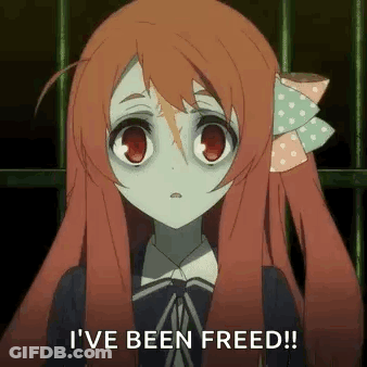 A Girl With Red Hair Is Standing In Front Of A Fence And Says `` I 'Ve Been Freed '' . GIF