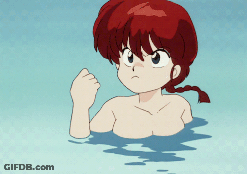 A Girl With Red Hair Is Swimming In A Pool GIF