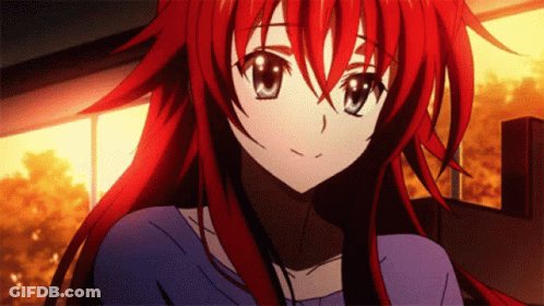 A Girl With Red Hair Is Wearing A Blue Top GIF
