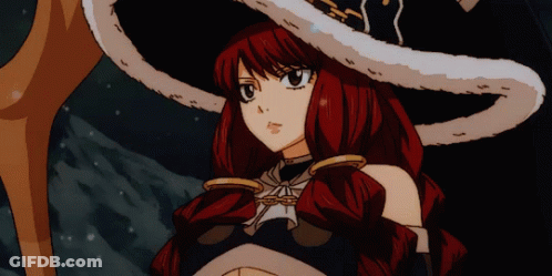 A Girl With Red Hair Is Wearing A Large White Hat GIF