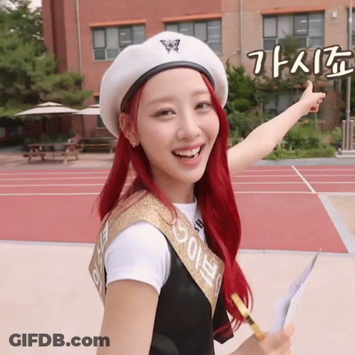 A Girl With Red Hair Is Wearing A White Beret And A Sash That Says ' Eunbi ' On It GIF