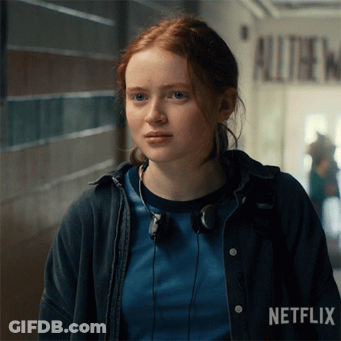A Girl With Red Hair Is Wearing Headphones And A Netflix Logo GIF