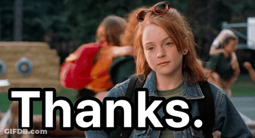 A Girl With Red Hair Is Wearing Sunglasses And A Denim Jacket And Says Thanks GIF