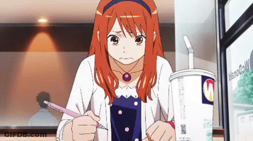 A Girl With Red Hair Is Writing On A Piece Of Paper In Front Of A Cup That Says Mcdonald 'S GIF