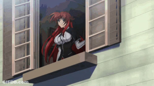 A Girl With Red Hair Looks Out A Window GIF