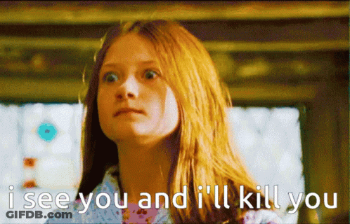 A Girl With Red Hair Says " I See You And I 'Ll Kill You " In Front Of A Window GIF