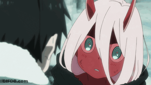 A Girl With Red Horns And Pink Hair Looks At A Man GIF