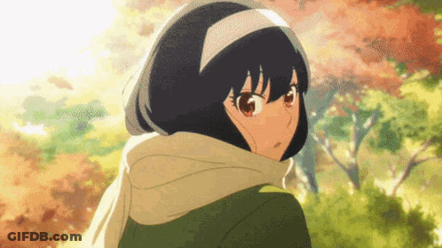 A Girl With Short Black Hair And Red Eyes Is Wearing A Scarf Around Her Neck And Head . GIF